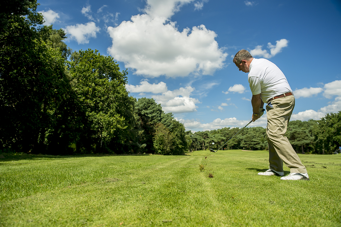 A person playing on the golf course
