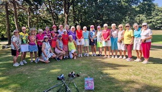 The Boscombe Ladies golf club posed in colourful clothing on the first tee of the golf course